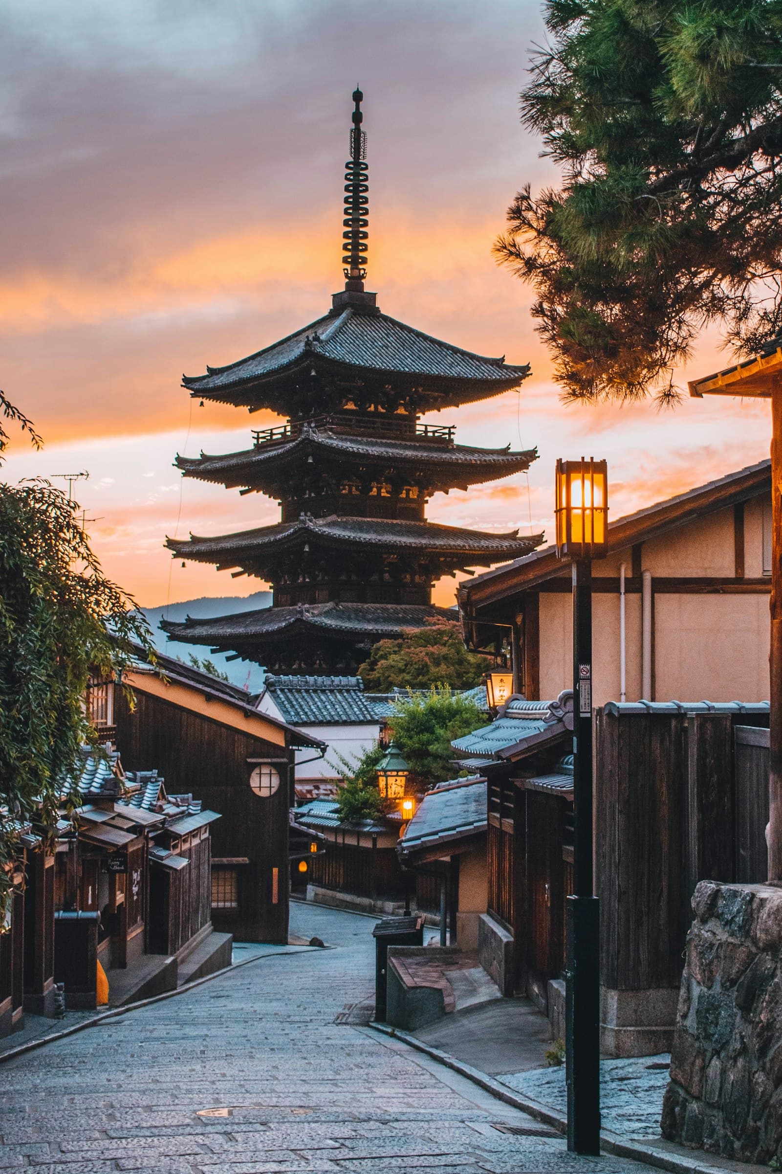 Pagoda above a quiet street in Kyoto, Japan, at sunset